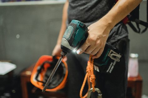 Handyman Holding Drill for Maintenance Services