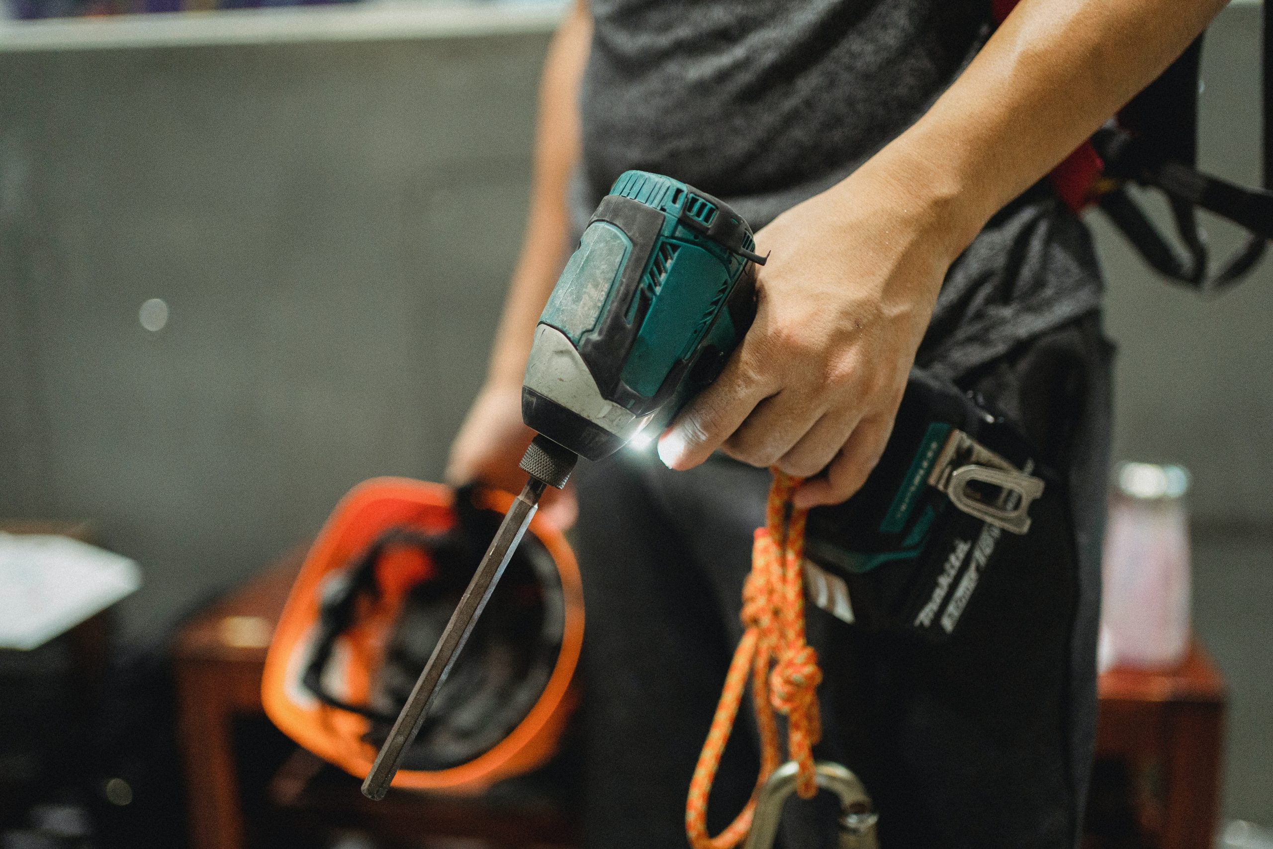 Handyman Holding Drill for Maintenance Services